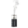 Black fog machine device with SmartLite branding emitting white smoke on a white background